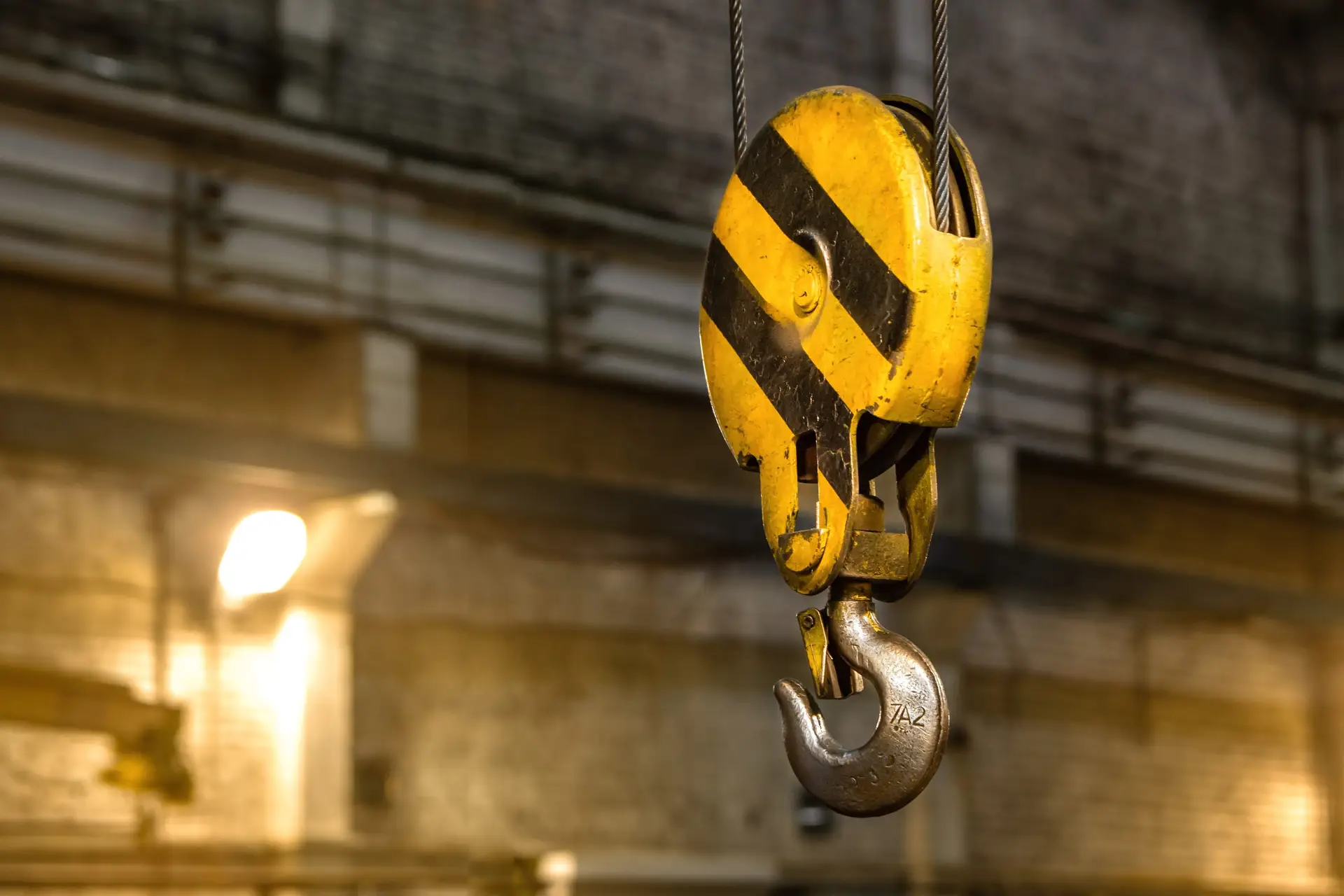 Overhead crane. Yellow and black hook crane.