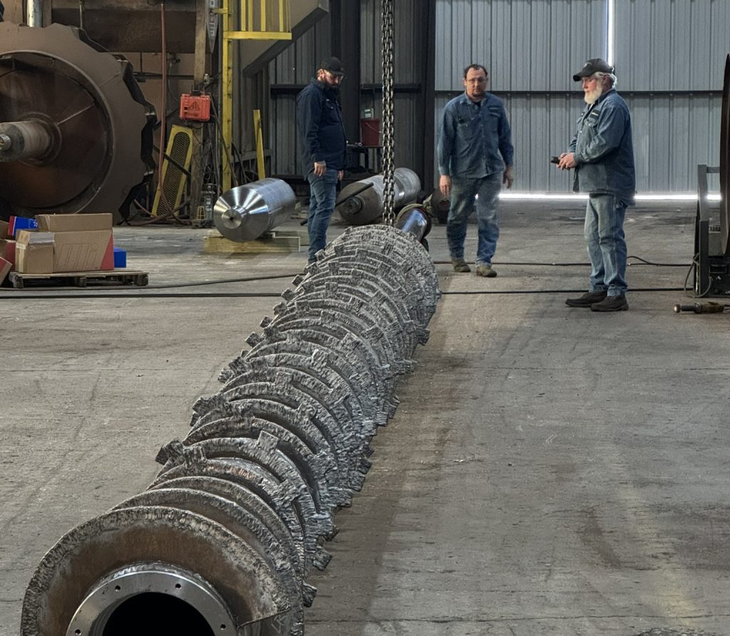 Industrial Field Service Management Crew with a Large Screw in a Warehouse