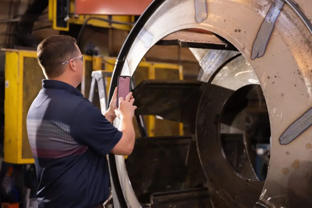 Field technician inspecting an industrial fan