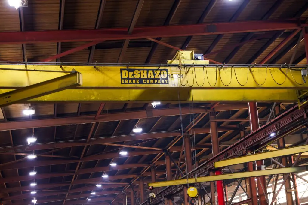 A DeSHAZO crane in an industrial field service environment