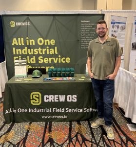crewOS CEO stands at the company booth at the SC&RA Crane and Rigging Workshop