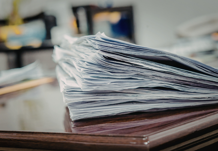stack of inspection reports in an industrial field office
